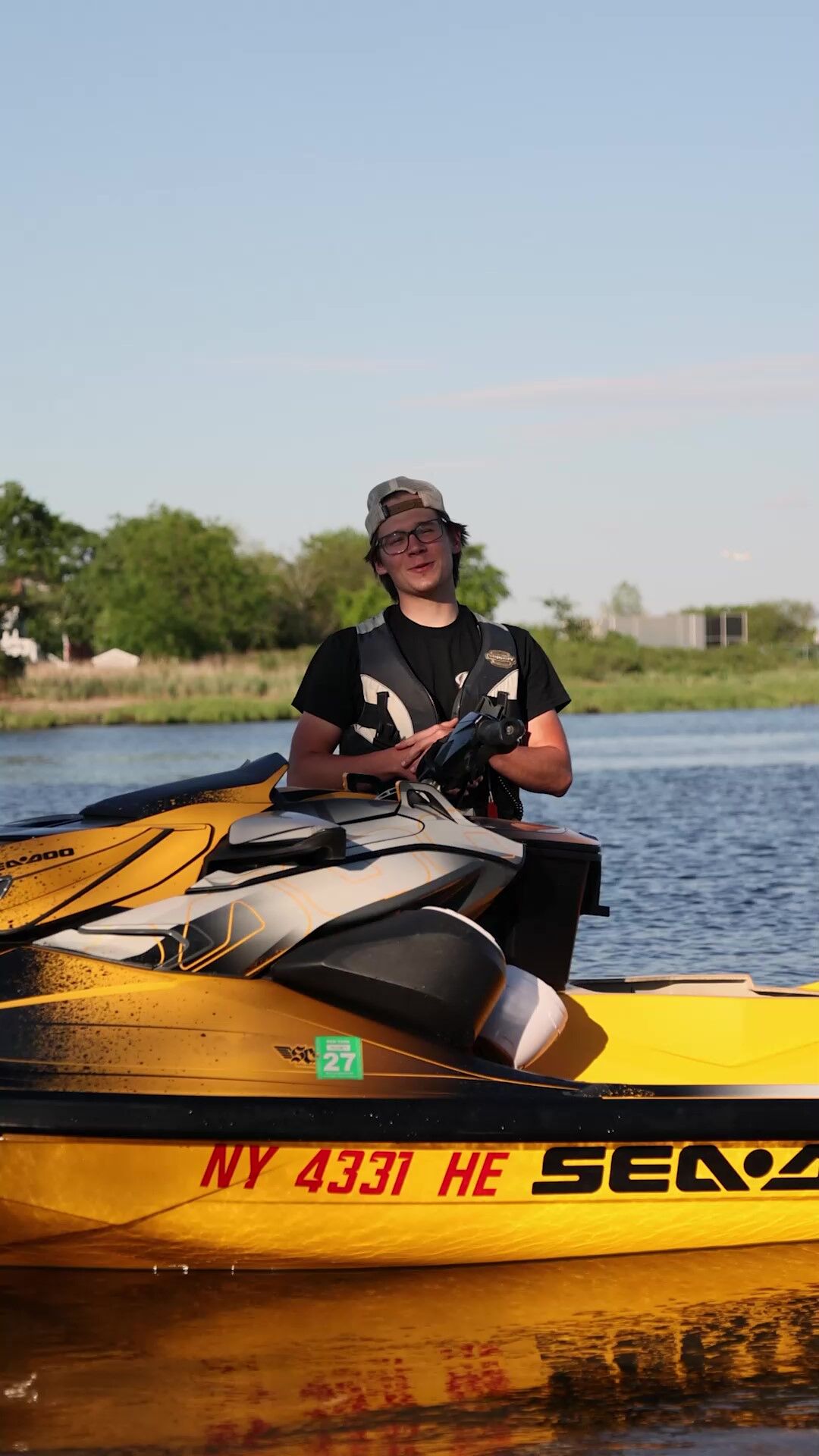 AOG Performance rider on a yellow Sea-Doo jet ski on the water