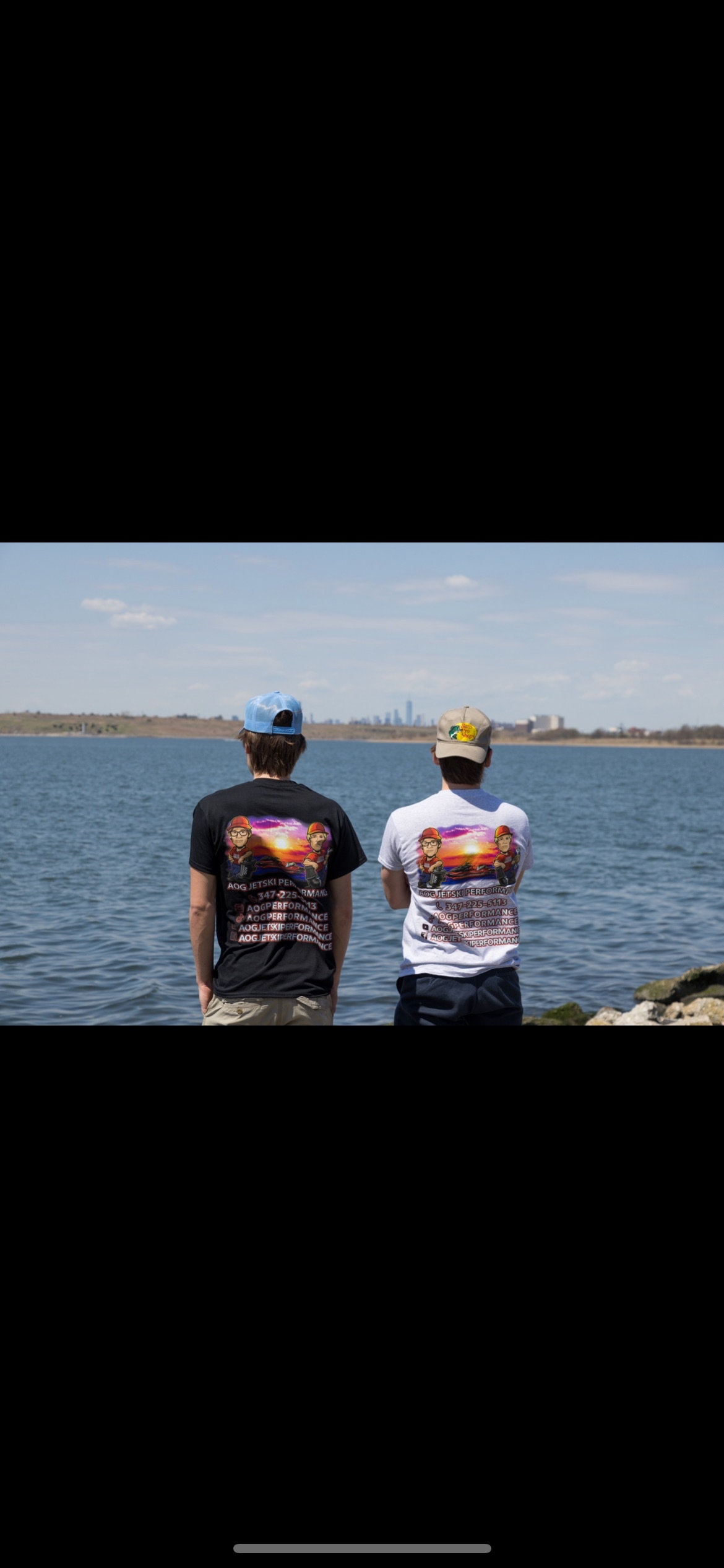 AOG Performance Black T-Shirt — back view with skyline